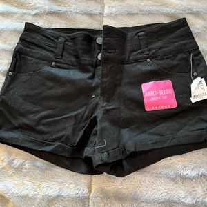 Mid-rise roll up refuge shorts size 4.